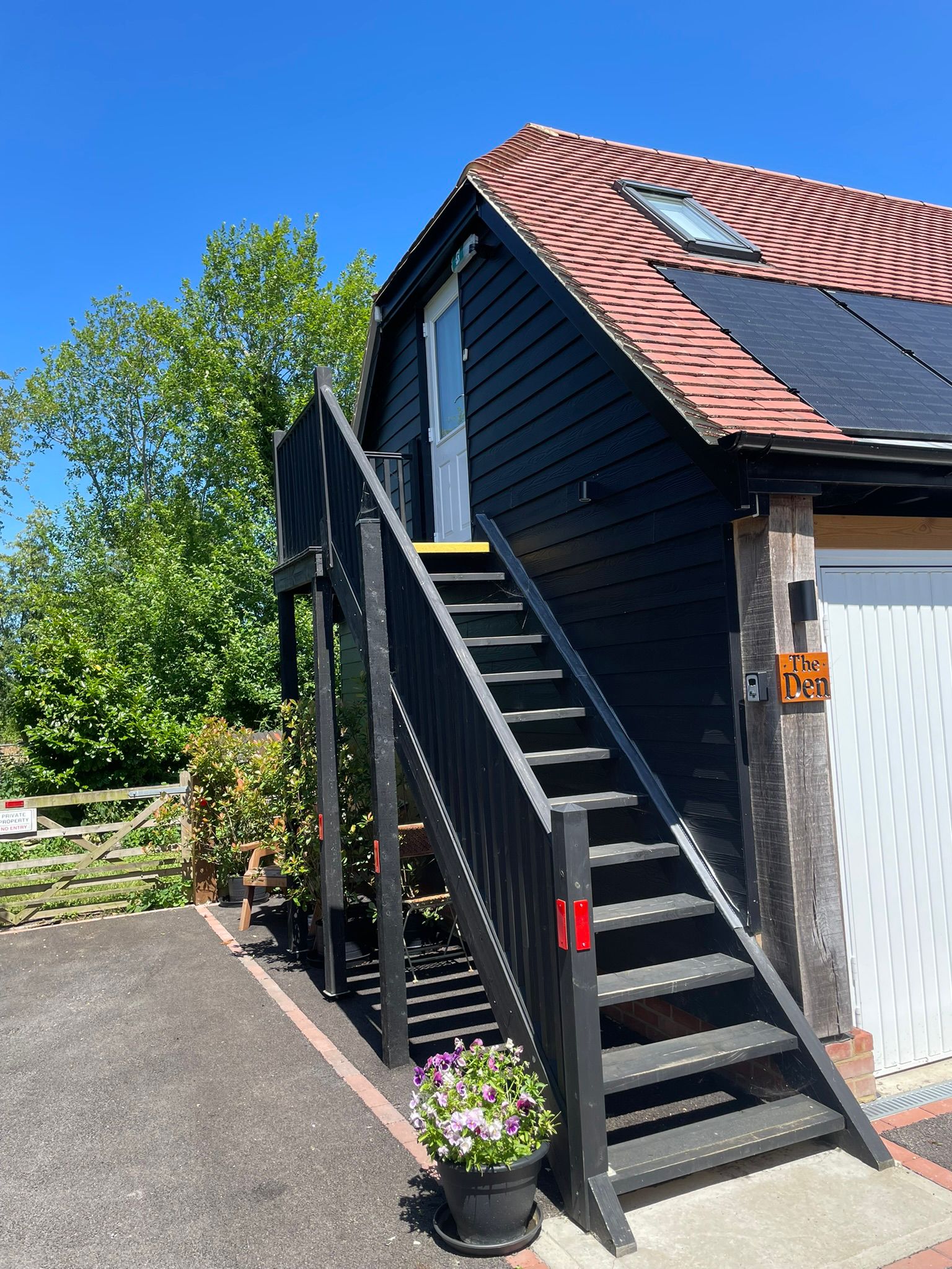 Exterior staircase entrance to the Den